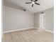 Bedroom featuring light wood floors, neutral paint and a view into the en-suite bathroom at 6335 E Brown Rd # 1098, Mesa, AZ 85205
