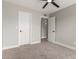 Bedroom showcasing plush carpet, neutral paint, a ceiling fan and two closets at 6335 E Brown Rd # 1098, Mesa, AZ 85205