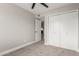 Bedroom featuring neutral walls, carpet, ceiling fan, and closet with white doors at 6335 E Brown Rd # 1098, Mesa, AZ 85205