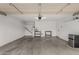 Spacious two-car garage with a concrete floor, ample lighting, and storage shelves at 6335 E Brown Rd # 1098, Mesa, AZ 85205