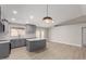 Open concept kitchen featuring modern gray cabinetry, an island, and stainless steel appliances at 6335 E Brown Rd # 1098, Mesa, AZ 85205