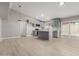 Spacious open kitchen area with gray cabinets, quartz countertops and wood floors at 6335 E Brown Rd # 1098, Mesa, AZ 85205