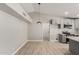 Bright open-concept living area with modern kitchen and hardwood floors at 6335 E Brown Rd # 1098, Mesa, AZ 85205