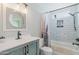 Bright bathroom with modern vanity, sleek fixtures, and tiled shower-tub combo at 6540 N 7Th Ave # 46, Phoenix, AZ 85013