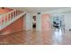Spacious living room with tile flooring, staircase, and easy access to kitchen at 6540 N 7Th Ave # 46, Phoenix, AZ 85013