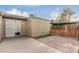 Cozy backyard featuring a storage shed, fenced yard, and concrete and brick paved patio at 6711 W Osborn Rd # 68, Phoenix, AZ 85033
