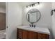 Updated bathroom vanity features a modern mirror and lighting at 6711 W Osborn Rd # 68, Phoenix, AZ 85033