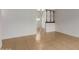 Living room with sleek white walls, decorative partition, and neutral tile flooring throughout the open space at 6711 W Osborn Rd # 68, Phoenix, AZ 85033