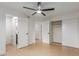 Spacious main bedroom features neutral walls, fan, and flooring, with an ensuite bathroom and closet at 6711 W Osborn Rd # 68, Phoenix, AZ 85033
