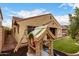 Backyard featuring play structure, low-maintenance turf, and a stucco home exterior at 6904 W Ashby Dr, Peoria, AZ 85383
