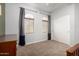 Well-lit bedroom with carpet flooring, soft natural light, and ample space to unwind and relax at 6904 W Ashby Dr, Peoria, AZ 85383