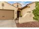 Inviting home exterior showcasing a warm color palette, mature landscaping, and a welcoming entrance at 6904 W Ashby Dr, Peoria, AZ 85383