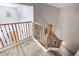Stylish staircase with carpet, wood and decorative metal handrail adds charm and elegance to the home at 6904 W Ashby Dr, Peoria, AZ 85383