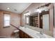 Spacious bathroom featuring double sinks, a large mirror, and decorative lighting creating a functional and stylish space at 6960 W Peoria Ave # 237, Peoria, AZ 85345