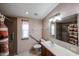 This bathroom features neutral toned walls, grab bars, and an accessible shower in a well-lit space at 6960 W Peoria Ave # 237, Peoria, AZ 85345