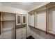Walk-in closet with built-in organizers and shelves providing ample storage for clothes and accessories at 6960 W Peoria Ave # 237, Peoria, AZ 85345