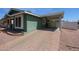 Paver driveway leading to a convenient covered carport, providing ample parking space at 6960 W Peoria Ave # 237, Peoria, AZ 85345