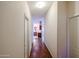 Hallway features wood-look floors, white walls, and doors leading to other rooms at 6960 W Peoria Ave # 237, Peoria, AZ 85345