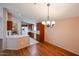 Open kitchen featuring an eat-in bar, wood cabinetry, and plenty of natural light at 6960 W Peoria Ave # 237, Peoria, AZ 85345