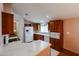 Well-equipped kitchen with white appliances, wood cabinets, and efficient layout at 6960 W Peoria Ave # 237, Peoria, AZ 85345