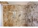 Walk-in shower featuring tile walls, built-in niche, and adjustable shower head creating a spa-like experience at 6960 W Peoria Ave # 237, Peoria, AZ 85345