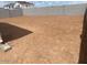 Spacious dirt backyard enclosed by a block wall, ready for landscaping at 7320 E Hackamore Ln, San Tan Valley, AZ 85143