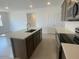 Open kitchen featuring a large island with modern appliances and ample counter space at 7320 E Hackamore Ln, San Tan Valley, AZ 85143