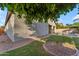 Beautiful backyard with a well-maintained lawn, mature tree, and view of the inviting pool and covered patio area at 735 W Ivanhoe St, Gilbert, AZ 85233