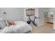 Bright bedroom with bed, workout bike, and mirrors, creating a serene and functional space at 735 W Ivanhoe St, Gilbert, AZ 85233