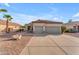 Charming single-story home featuring a spacious three-car garage, tile roof, and low-maintenance desert landscaping at 735 W Ivanhoe St, Gilbert, AZ 85233