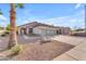 Inviting single-story home with a three-car garage and desert landscaping for low maintenance appeal at 735 W Ivanhoe St, Gilbert, AZ 85233