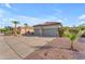 Attractive single-story home with a three-car garage and desert landscaping for low maintenance appeal at 735 W Ivanhoe St, Gilbert, AZ 85233