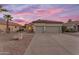 Charming single-story home featuring a low-maintenance desert landscape and a spacious two-car garage at 735 W Ivanhoe St, Gilbert, AZ 85233