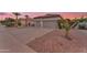 Single-story home featuring a low-maintenance desert landscape and a spacious two-car garage at 735 W Ivanhoe St, Gilbert, AZ 85233