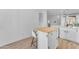Clean kitchen island with butcher block top, white cabinets, and bar stool seating at 735 W Ivanhoe St, Gilbert, AZ 85233
