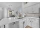 Clean and modern kitchen with white countertops, stainless sink, and under-cabinet lighting at 735 W Ivanhoe St, Gilbert, AZ 85233