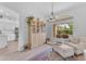 Cozy living room with a soft palette, natural light, and elegant chandelier at 735 W Ivanhoe St, Gilbert, AZ 85233