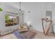 Bright and airy sitting room with neutral tones, wood floors, and a sunlit window at 735 W Ivanhoe St, Gilbert, AZ 85233