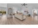 Bright and airy living room with neutral tones, featuring wood floors and an open layout to the dining area at 735 W Ivanhoe St, Gilbert, AZ 85233