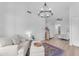 Bright living room with comfortable seating, a decorative rug, and light wood floors at 735 W Ivanhoe St, Gilbert, AZ 85233