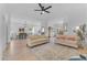 Spacious open-concept living room featuring lots of natural light and light wood flooring at 735 W Ivanhoe St, Gilbert, AZ 85233