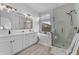 Luxurious bathroom with double vanity, soaking tub, and glass-enclosed shower at 735 W Ivanhoe St, Gilbert, AZ 85233