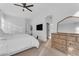 Spacious main bedroom with ensuite access featuring neutral walls, soft carpet, and a modern dresser at 735 W Ivanhoe St, Gilbert, AZ 85233