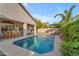 Inviting pool area with a covered patio, dining set, and lounge seating, creating a perfect outdoor living space at 735 W Ivanhoe St, Gilbert, AZ 85233