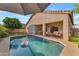View of the sparkling pool with a covered patio featuring a dining set and cozy seating area in the backyard at 735 W Ivanhoe St, Gilbert, AZ 85233