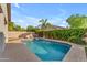 Beautiful pool with inviting clear water, surrounded by lush landscaping and lounge chairs, perfect for relaxation at 735 W Ivanhoe St, Gilbert, AZ 85233