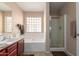 Bright bathroom featuring a walk-in shower, soaking tub, and natural light at 749 E Desert Moon Trl, San Tan Valley, AZ 85143
