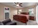 Cozy bedroom featuring a ceiling fan, closet, and comfortable furniture for relaxation at 749 E Desert Moon Trl, San Tan Valley, AZ 85143