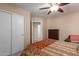 Comfortable bedroom featuring a ceiling fan, closet, and dresser for storage at 749 E Desert Moon Trl, San Tan Valley, AZ 85143