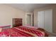 Bedroom featuring a bed, closet and chest of drawers, offering ample storage and neutral tones at 749 E Desert Moon Trl, San Tan Valley, AZ 85143